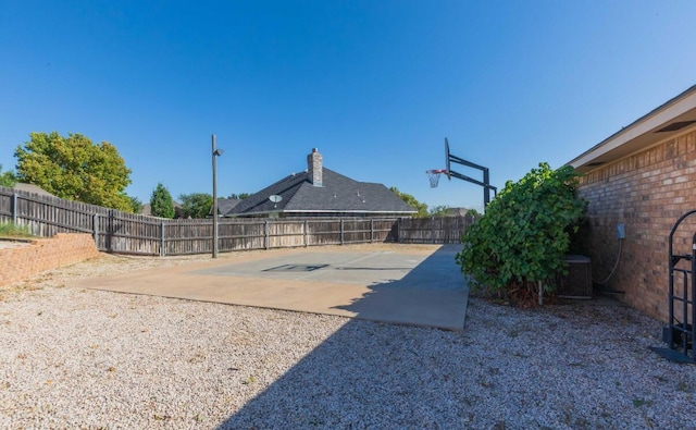 view of sport court with a fenced backyard