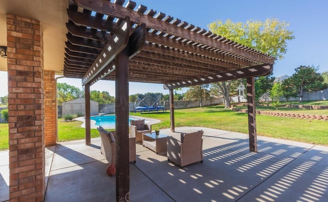 view of patio with a trampoline, a storage shed, a pergola, and an outdoor structure