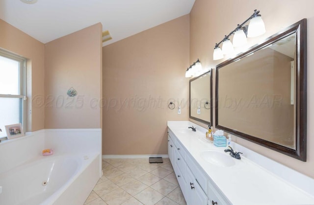 bathroom featuring baseboards, a garden tub, tile patterned flooring, and double vanity
