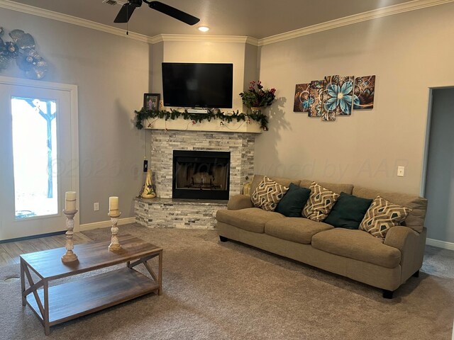 1712 NE 6th St, Dumas, TX 79020 - carpeted living area with ornamental molding, a ceiling fan, a fireplace, and recessed lighting