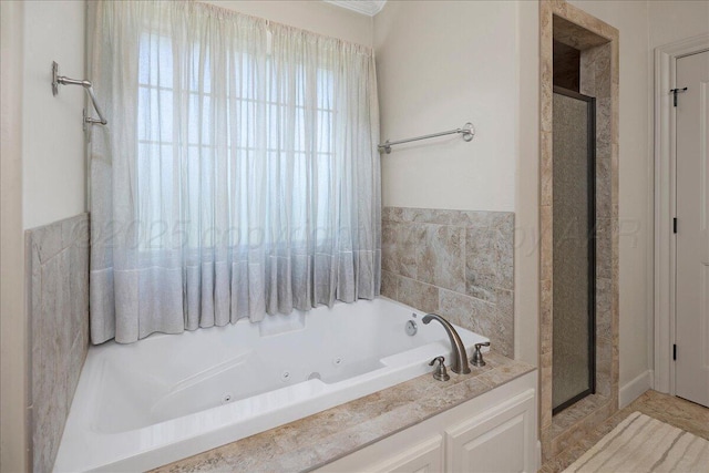 19550 Saddlehorn Rd, Amarillo, TX 79119 - bathroom featuring a whirlpool tub and a stall shower