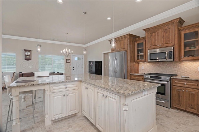 19550 Saddlehorn Rd, Amarillo, TX 79119 - kitchen featuring stainless steel appliances, brown cabinetry, a chandelier, light stone countertops, and crown molding