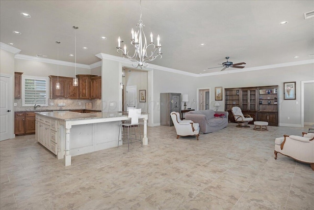 19550 Saddlehorn Rd, Amarillo, TX 79119 - living area with a ceiling fan, crown molding, recessed lighting, a chandelier, and baseboards