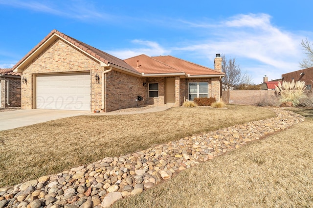 ranch-style home with a garage and a front yard