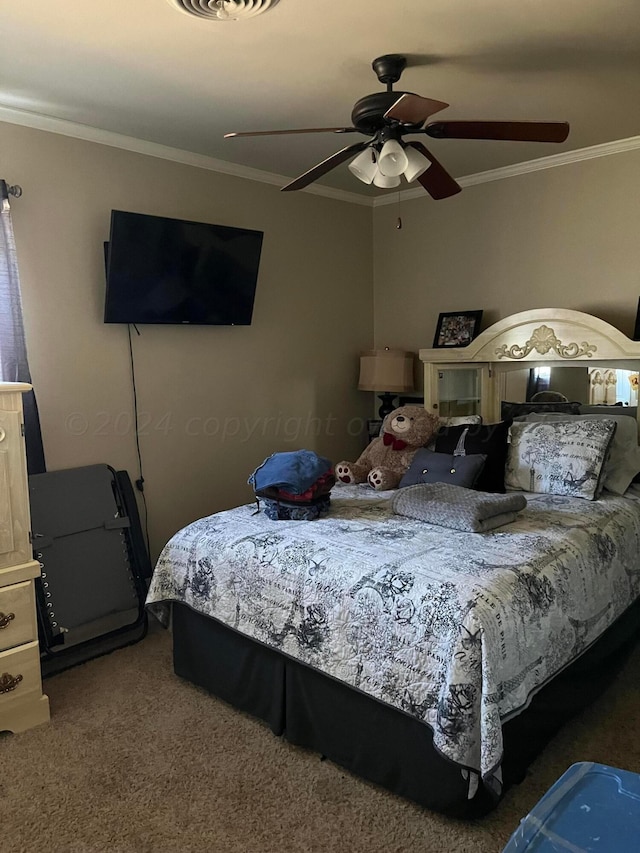 carpeted bedroom featuring a ceiling fan and crown molding