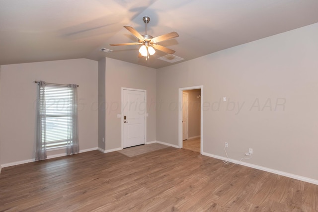 empty room with a ceiling fan, baseboards, visible vents, and light wood-style flooring