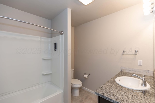 full bath featuring tile patterned floors, baseboards, vanity, toilet, and bathing tub / shower combination