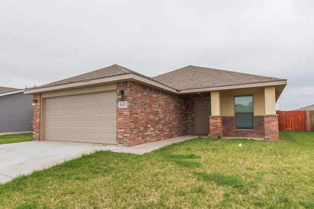 single story home featuring a garage, fence, a front yard, roof with shingles, and brick siding