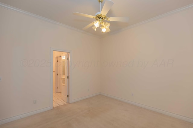 carpeted empty room featuring crown molding and ceiling fan