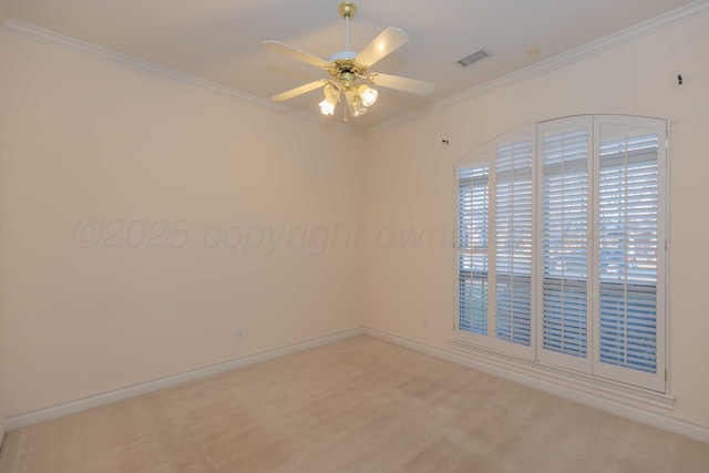 carpeted empty room with ceiling fan and ornamental molding