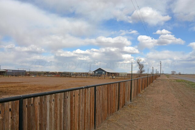 view of yard with a rural view