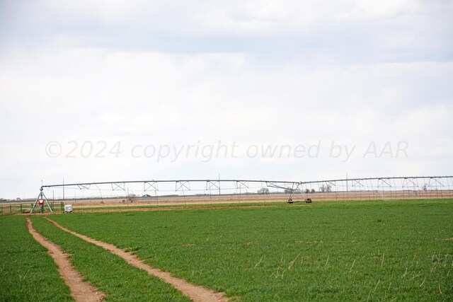 surrounding community with a lawn and a rural view