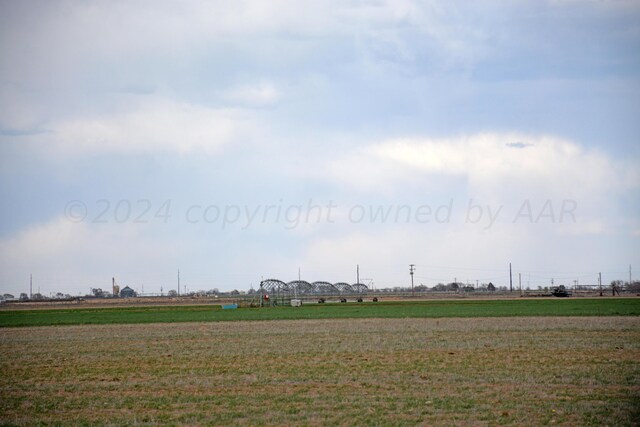 view of yard with a rural view