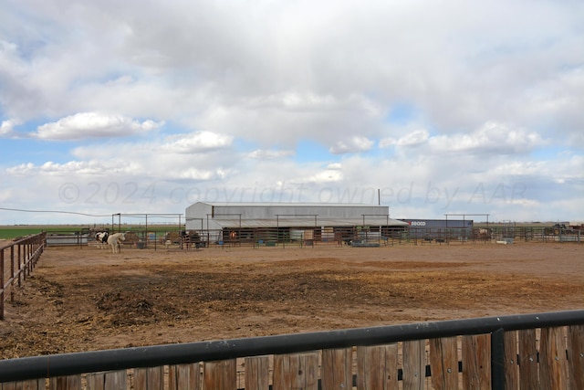 view of yard with a rural view