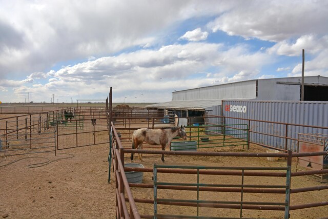 exterior space with an outbuilding and a rural view