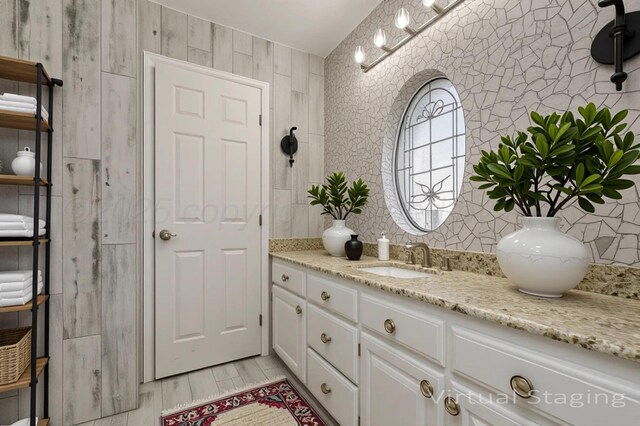 7715 Tarrytown Ave, Amarillo, TX 79121 - bathroom featuring vanity, tasteful backsplash, and wood finished floors