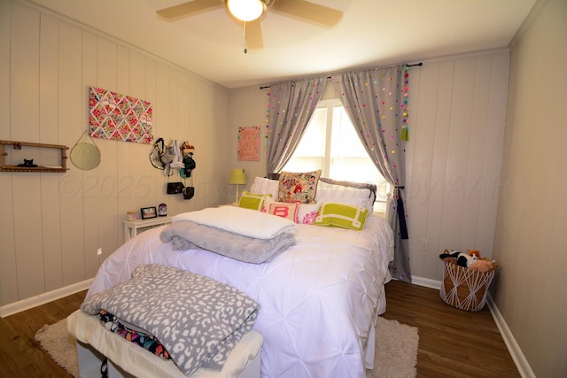 bedroom featuring ceiling fan and dark hardwood / wood-style flooring