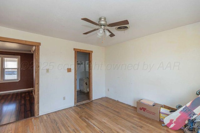 505 N Grace St, Stratford, TX 79084 - unfurnished bedroom featuring hardwood / wood-style flooring, ceiling fan, and baseboards