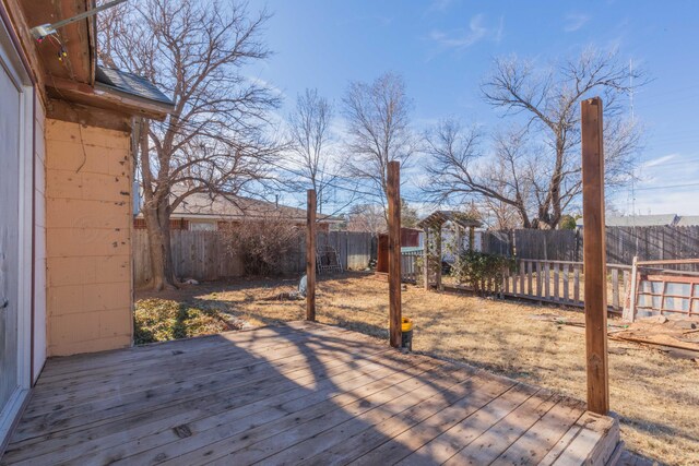 505 N Grace St, Stratford, TX 79084 - wooden deck with a fenced backyard
