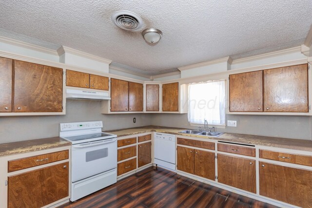 505 N Grace St, Stratford, TX 79084 - kitchen with white appliances, a sink, under cabinet range hood, brown cabinetry, and dark wood-style flooring