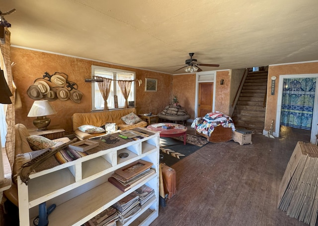 living room with ceiling fan and dark wood-type flooring