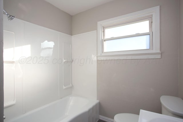 1928 Cherry St, Amarillo, TX 79106 - bathroom with toilet and bathing tub / shower combination