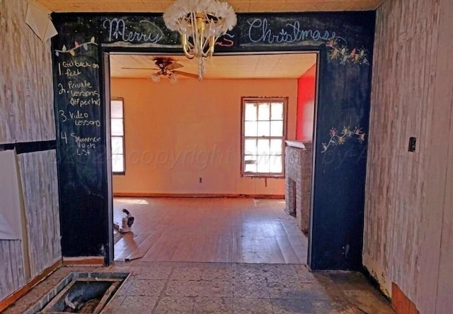 spare room with hardwood / wood-style flooring and ceiling fan