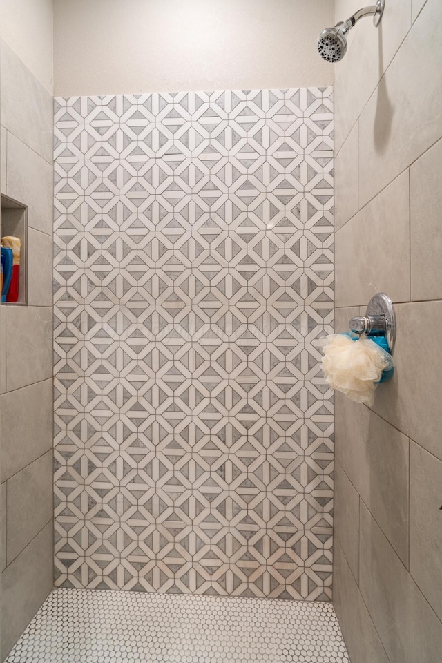 full bath featuring a tile shower