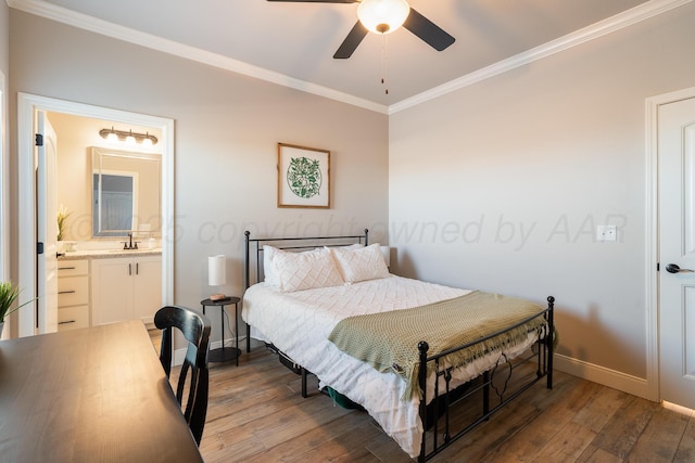 bedroom with hardwood / wood-style floors, baseboards, ensuite bath, ceiling fan, and crown molding