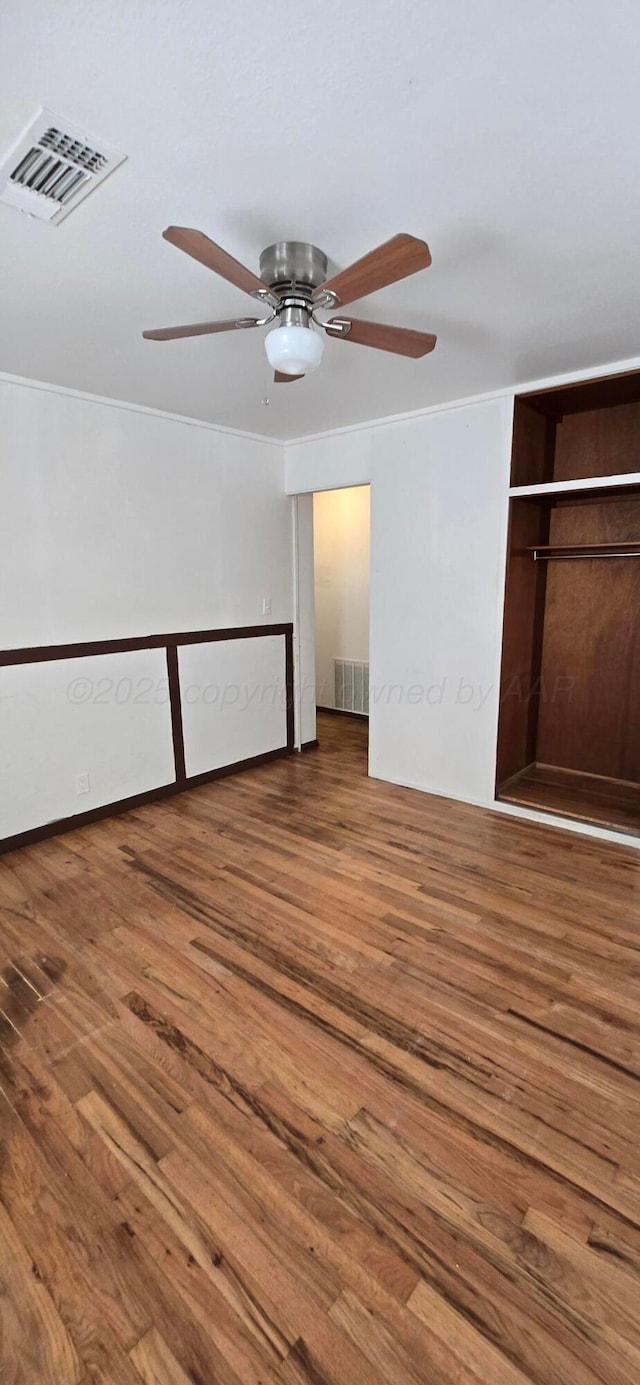 unfurnished bedroom featuring ceiling fan and wood-type flooring