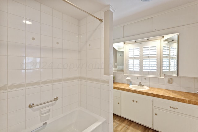 full bath with wood finished floors and vanity