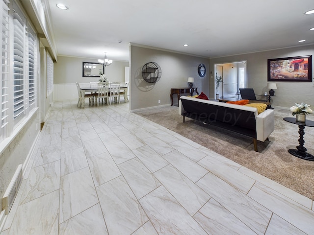 living room with marble finish floor, crown molding, recessed lighting, and an inviting chandelier