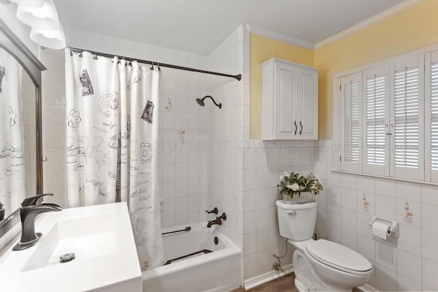 bathroom featuring tile walls, shower / bath combo, crown molding, toilet, and vanity