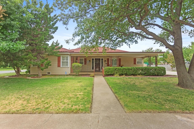 ranch-style home with a front yard and covered porch