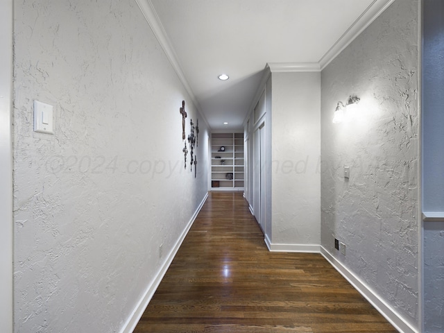 hallway with crown molding, recessed lighting, a textured wall, baseboards, and wood finished floors