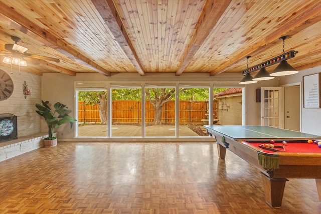 rec room with wood walls, a ceiling fan, beam ceiling, billiards, and wooden ceiling