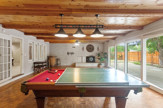 rec room featuring wood ceiling, beam ceiling, pool table, and a fireplace