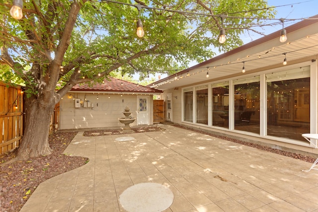 view of patio featuring fence