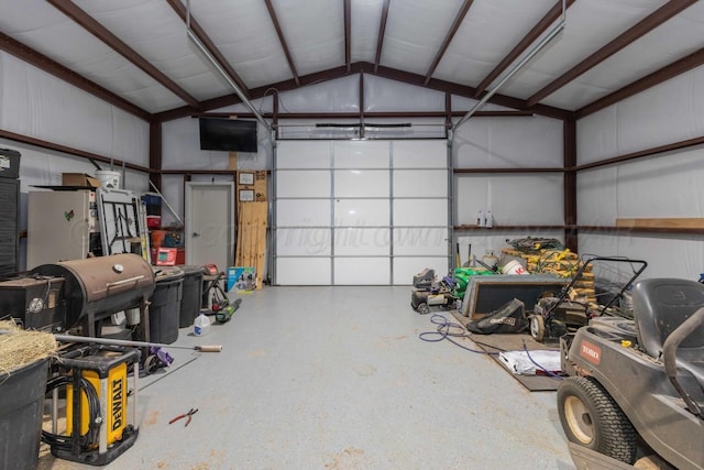 garage featuring white fridge