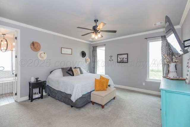 bedroom with ceiling fan, ensuite bath, light carpet, and crown molding