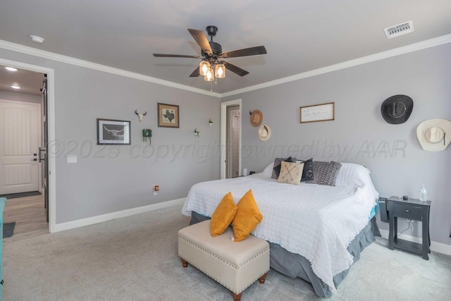 bedroom with ceiling fan, light carpet, and ornamental molding