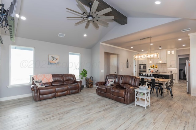 living room featuring ceiling fan, lofted ceiling with beams, crown molding, and light hardwood / wood-style flooring