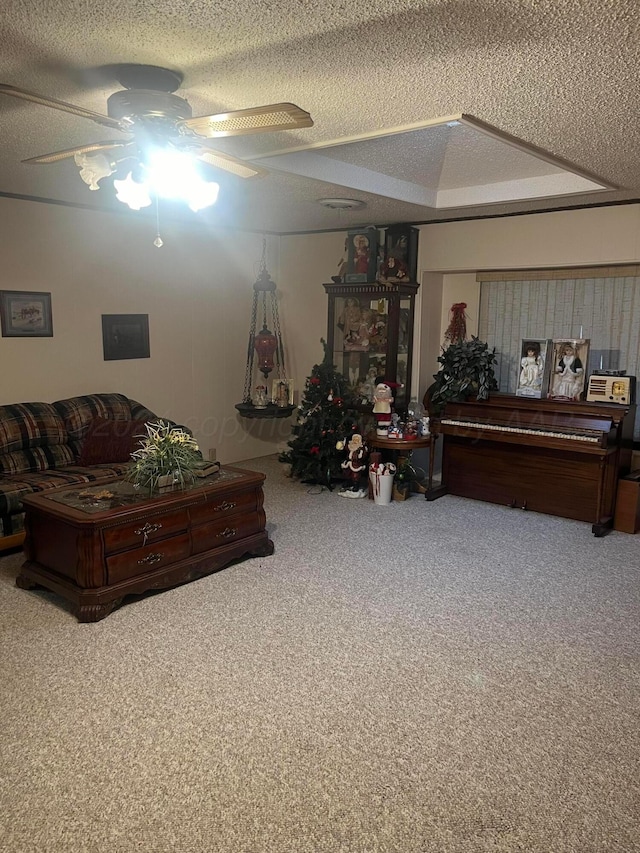 living room with carpet floors, a textured ceiling, and ceiling fan