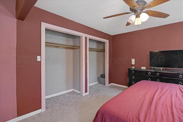 4317 Cline Rd, Amarillo, TX 79110 - bedroom with carpet flooring, multiple closets, baseboards, and ceiling fan