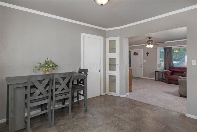 4317 Cline Rd, Amarillo, TX 79110 - carpeted dining room featuring baseboards, crown molding, and a ceiling fan