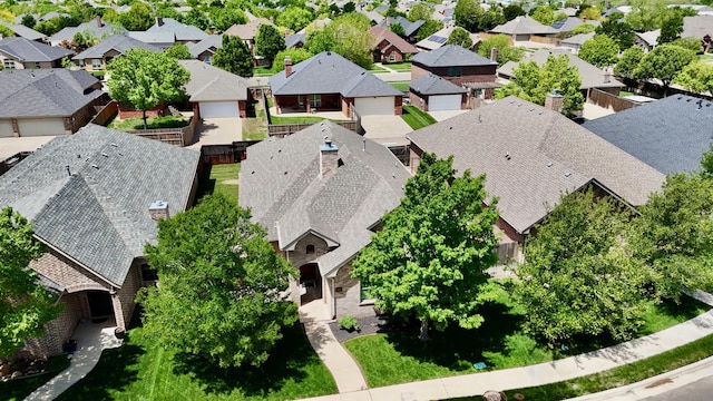 birds eye view of property with a residential view