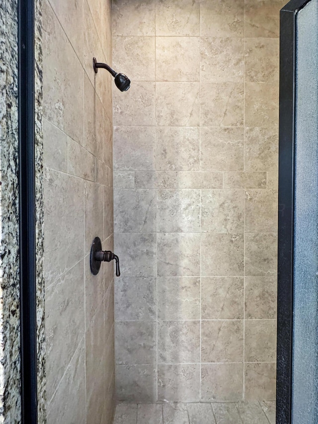 full bathroom with a tile shower