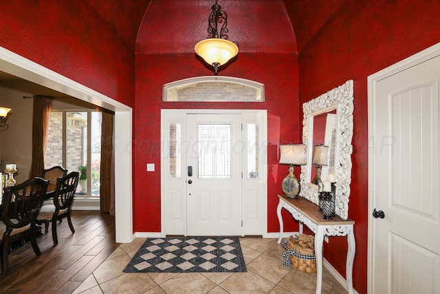 18150 19th St, Amarillo, TX 79124 - entrance foyer with baseboards, a high ceiling, and light tile patterned floors