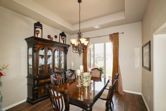 18150 19th St, Amarillo, TX 79124 - dining space with a chandelier, dark wood-style flooring, baseboards, and a raised ceiling