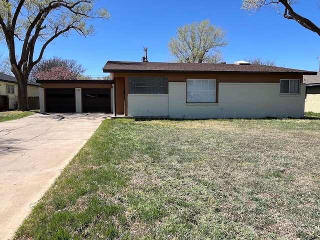 single story home with a garage and a front yard